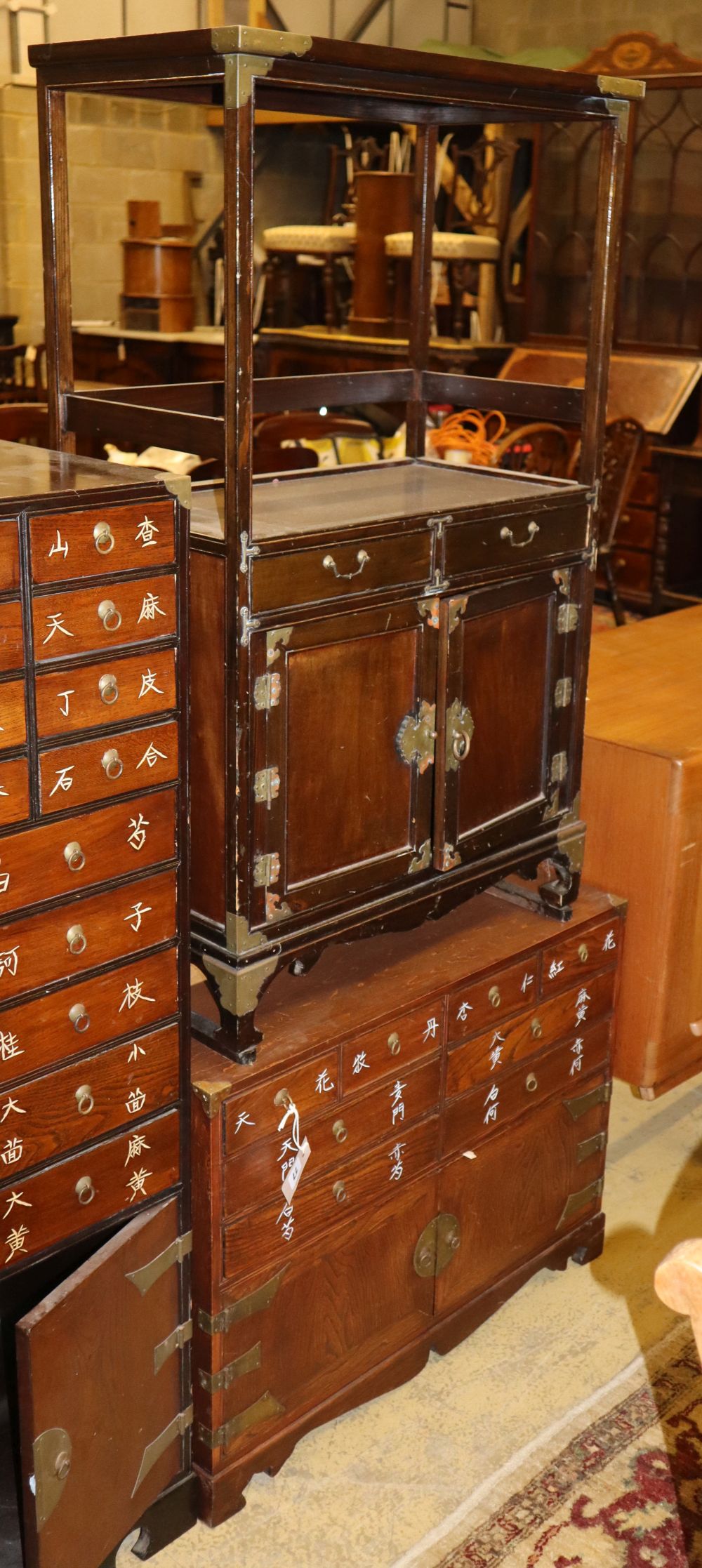 Two Chinese medicine cabinets, larger H.105cm